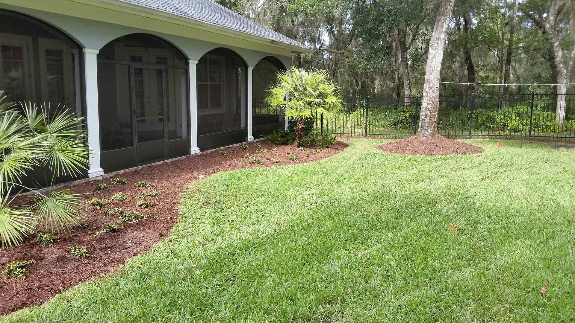 Backyard of a residential customer who is receiving lawn mowing and maintenance services.