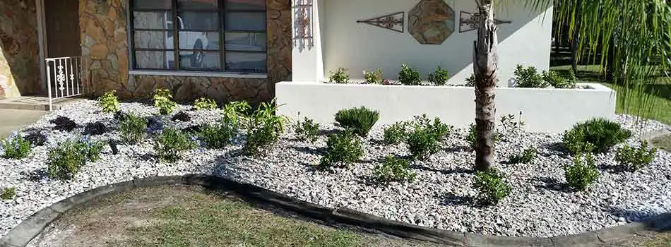 This homeowner in Hernando Beach, FL has opted to have white river rock installed into their landscape bed.